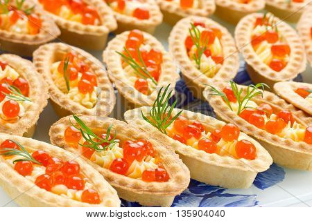 Tartlets with red caviar. Cocktail party snacks with red caviar gourmet food festive appetizer