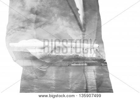 Double Exposure Of Businessman Hand Hold Tablet, Cargo Port Ship At Sea Port Concept
