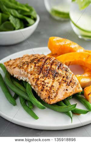 Grilled blackened salmon fillet with grilled butternut squash