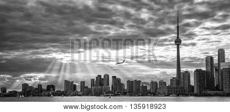 TORONTO SKYLINE IN BLACK AND WHITE WITH SUNBEAMS