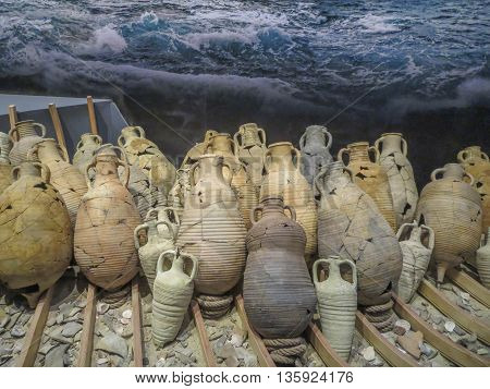Ancient clay oil bottles or urns from archaeology ruins.