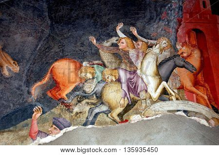 Bolzano Italy - June 2 2006: Painted wall fresco depicting sinners going to Hell covers a wall inside the 14th century Dominican  Catholic Church