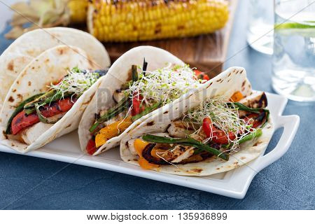 Vegan tacos with grilled tofu, herbs and vegetables