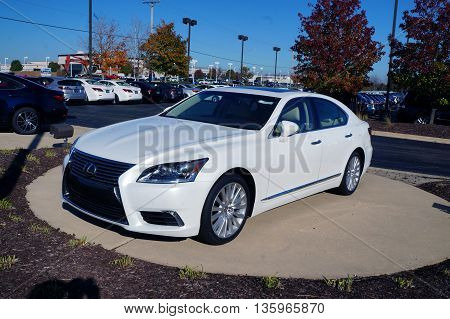 NAPERVILLE, ILLINOIS / UNITED STATES - NOVEMBER 3, 2015: A white luxury sedan is on display on the lot at Lexus of Naperville.