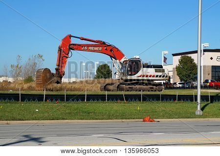 NAPERVILLE, ILLINOIS / UNITED STATES - NOVEMBER 3, 2015: A Link-Belt 330LX hydraulic excavator, owned by J.S. Riemer, is ready to dig in Naperville.