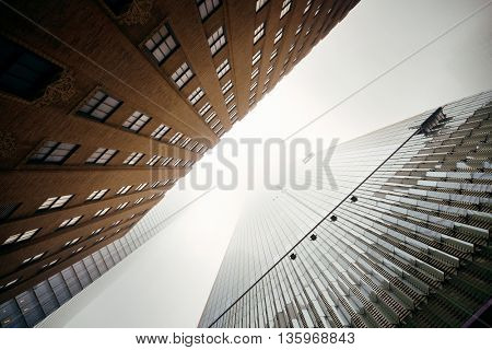 NEW YORK CITY - NOV 12: Downtown skyscrapers in a foggy day on November 12, 2014 in Manhattan, New York City. With population of 8.4M, it is the most populous city in the United States.