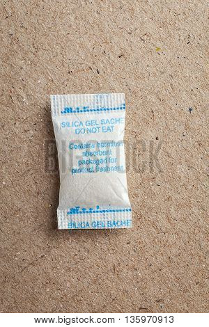 Close Up Silica Gel Or Desiccant In Paper Bag Background