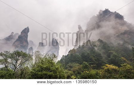 Surreal And Misty View Of Unique Rock Formation In Hunan China.