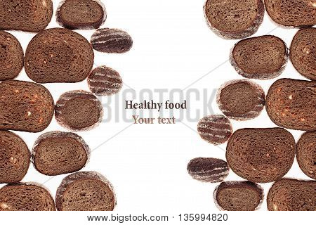 Decorative edging pieces of black rye bread on a white background. Isolated. Border. Pattern. Food background. View from above.