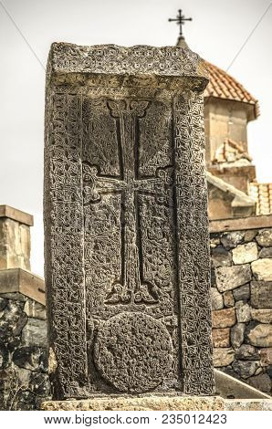 The Darkened Seventh Century Stone Cross  At The Entrance Of The Church Of Karmravor In The City Of 