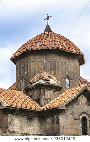 Octagonal Stone Drum With Umbrella-shaped Roof, Covered With Red Tiles And Forged Cross On The Cross