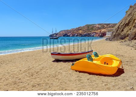 Pedalo With Rescue Boat On Beautiful Sandy Paleochori Beach On Milos Island. Cyclades, Greece.