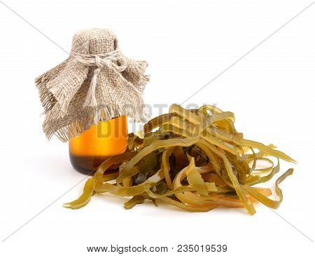 Kelp ( Laminaria ) Iwith Pharmaceutical Bottle. Isolated On White Background.