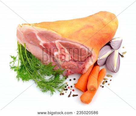 Raw Eisbein Or Ham Hock, Or Schweinshaxe With Wegetables. Isolated On White Background.