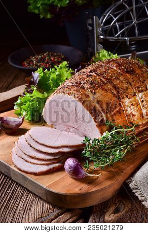 A Tasty Cooked Ham With Colorful Pfefer