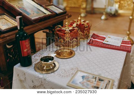 Wedding In The Orthodox Church. Two Ceremonial Crowns, A Bottle Of Cahors, A Golden Saucer With Wedd