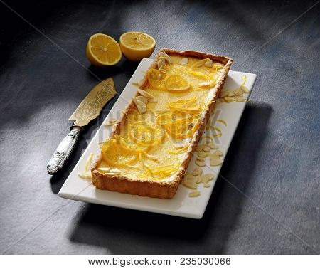 Baked Classic French Lemon Tart Decorated With Lemon Slices