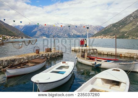 Cold Day. Montenegro, View Of Bay Of Kotor Near Small Harbor With Fishing Boats In Stoliv Village
