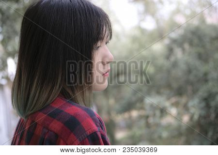Portrait Of Asian Girl With Looking At Camera On White Background.