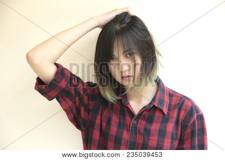Portrait Of Asian Girl With Looking At Camera On White Background.