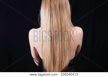 Back View Of Young Sexy Girl In Black Lace Body And Blonde Hair Isolated On Black. Elegant Woman Wea