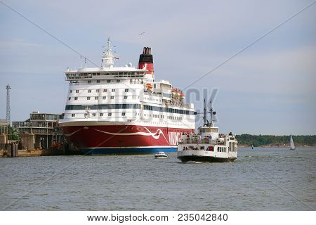 Helsinki, Finland - June 11, 2017: A Tourist Boat On The Background Of The Sea Cruise Ferry 