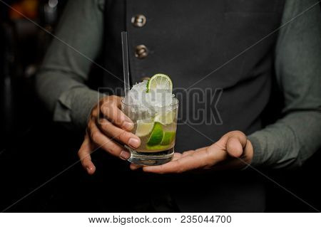 Professional Bartender Serving A Delicious Fresh Cocktail In The Cocktail Glass At The Steel Barstan