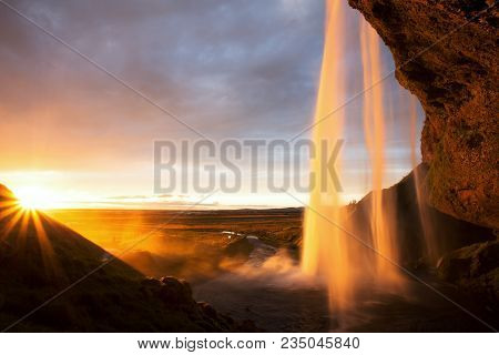 Huge Seljalandfoss Waterfall At Sunset On Iceland