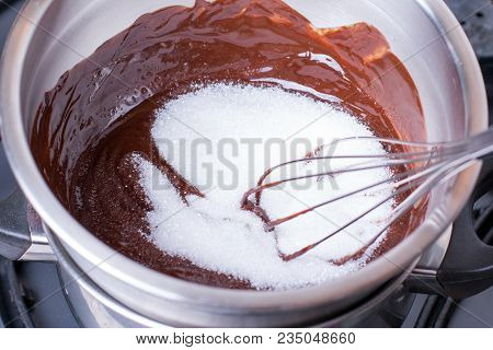 Chocolate And Sugar In A Bowl On A Wooden Table. Cooking Brownie