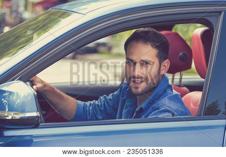 Happy Man With Hands On Wheel Driving New Car