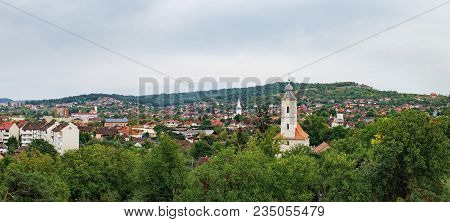 Red Roofs Of The Hunedoara City In Hunedoara County In Transylvania, Romania, Where The Corvin Castl
