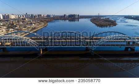 Aerial View Of The City, Ukraine. Dnieper River With Bridges. Darnitskiy Bridge. Combined Railway An