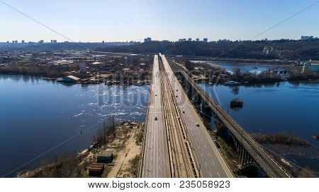 Aerial View Of The City, Ukraine. Dnieper River With Bridges. Darnitskiy Bridge. Combined Railway An