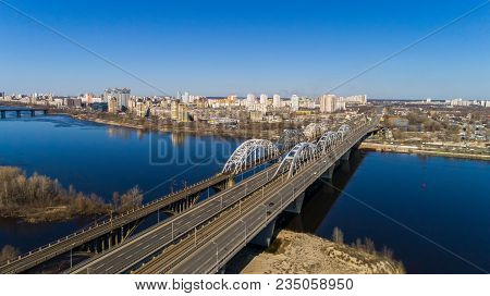 Aerial View Of The City, Ukraine. Dnieper River With Bridges. Darnitskiy Bridge. Combined Railway An