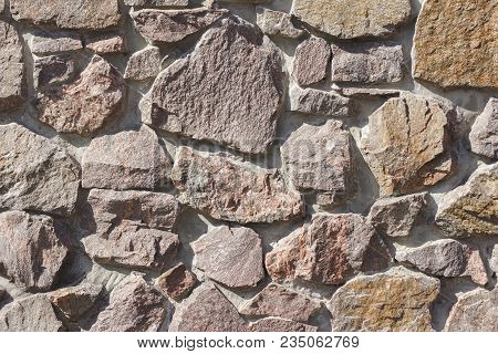 Wall Made Of Granite Stones As Background.