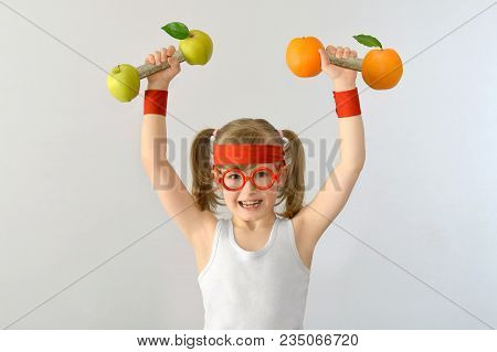 Kid, Child Bespectacled Lifts Weights From Apples Oranges.
