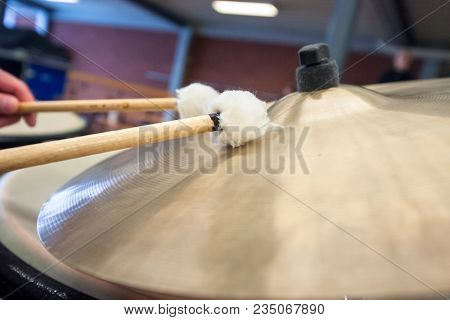 Musician Plays The Cymbals Of A Kettledrum With Drumstick