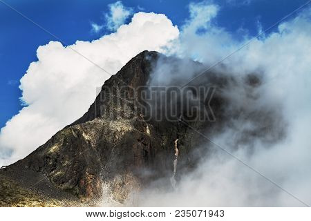 Mountain Peak Covered By White Clouds From Tito Secchi Refuge In Valsabbia, Brescia, Italy.