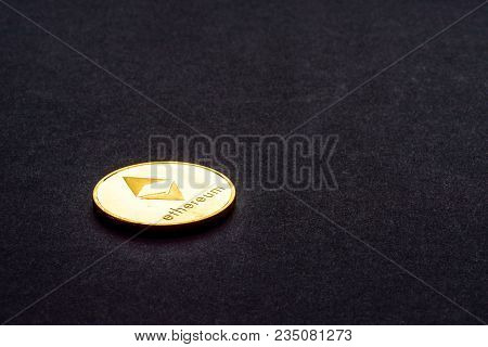 Golden Virtual Money Ethereum Crypto Currency Coin On A Dark Background.