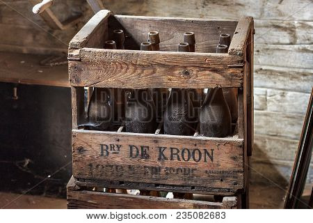 Neerijse, Belgium - September 05, 2014: Wooden Box With Old Vintage Beer Bottles In The Brewery De K