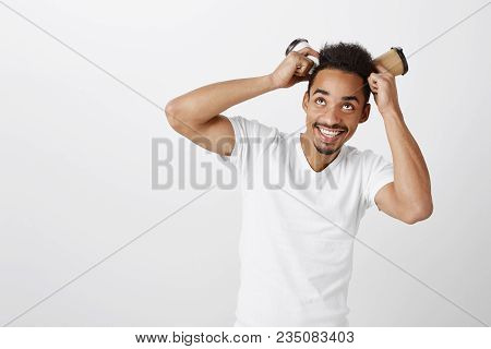 Feeling Connection With Space. Portrait Of Attractive Childish Dark-skinned Guy With Afro Hairstyle,