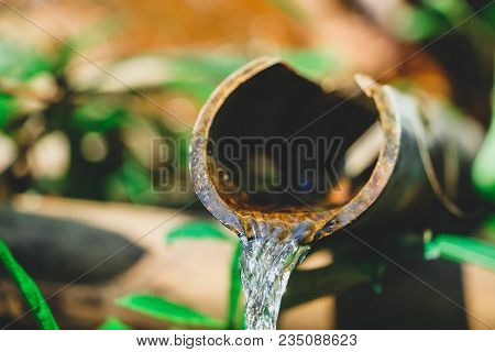 The Water Flows From The Bamboo Tube.