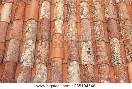 Roof Of Tiles. Terracotta Old Tiles. Beige Background From Tiles. Tile Roof.