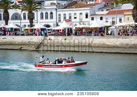 Lagos, Portugal - June 9, 2017 - Tourists Aboard Small Tour Boats Along The River Bensafrim With Vie