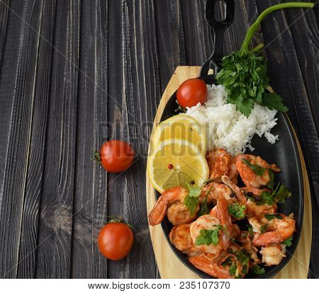 Roasted Shrimps With Lemon, Garlic,herbs And White Rise, Seafood Shelfish Shrimps Prawns Grilled Wit