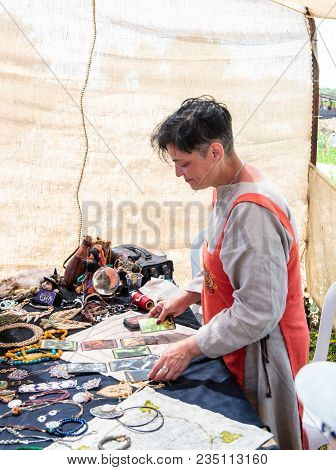 Goren, Israel, April 06, 2018 : Fortune Teller On Tarot Cards - Participant Of The Knight Festival P