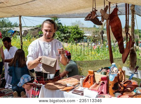 Goren, Israel, April 06, 2018 : The Tanner Shows Visitors Of The Knight Festival How To Sew A Purse 