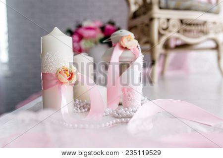 Candle Are Decorated With Pink Bow, Ribbon And Greens Stand On The Festive Table Newlyweds Covered W