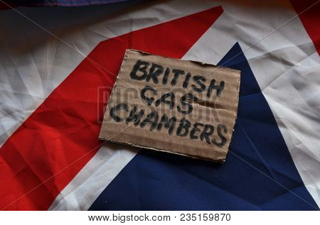The scandal about poisoning of former Russian spy and killing his domestic pets cat and Guinean pigs. Animal abuse.Concept. British Flag background.April 7, 2018 in Kiev,Ukraine