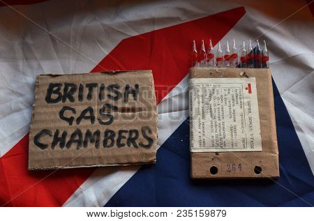 The scandal about poisoning of former Russian spy and killing his domestic pets cat and Guinean pigs. Animal abuse.Concept. British Flag background.April 7, 2018 in Kiev,Ukraine